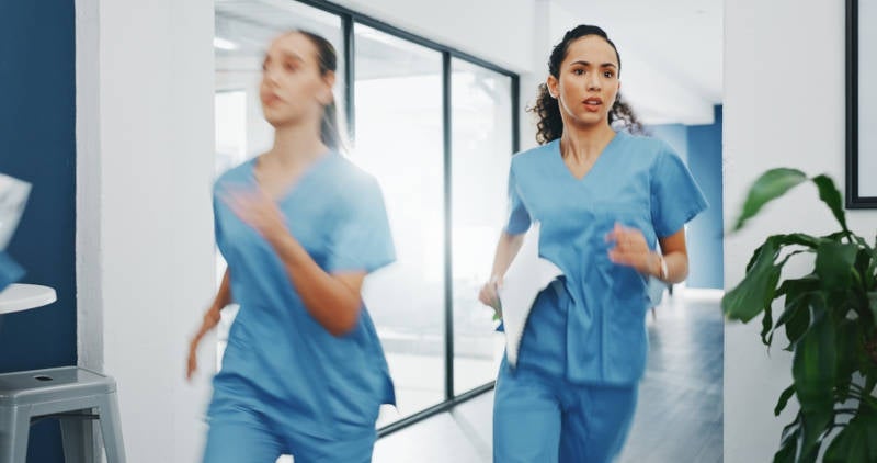Nurse running down a hall