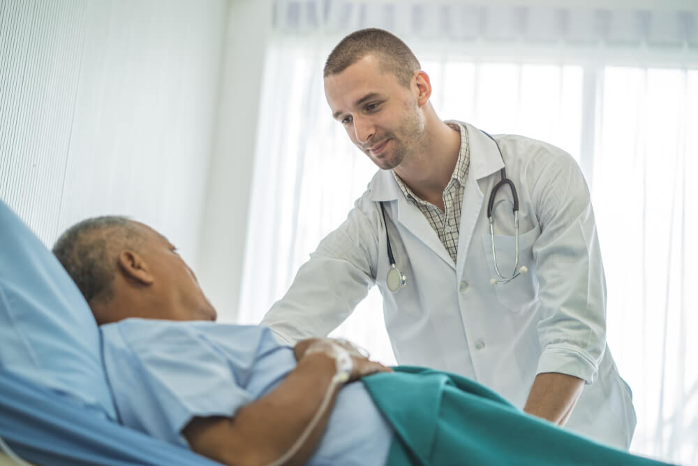 A mental health nurse practitioner consoling their patient